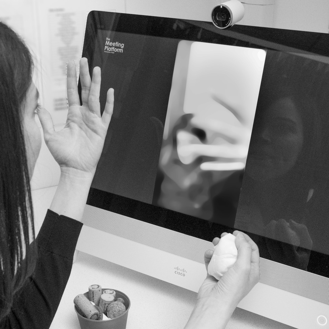 Ms Michelle Razo conducting a virtual hand therapy consultation on HSC Northern Ireland's Cisco-powered telehealth system, The Meeting Platform
